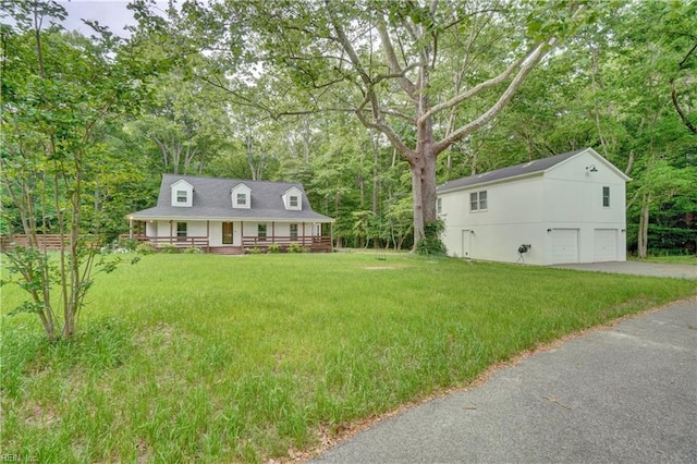 490 Poplar Lawn Rd, Surry, VA 23883 - cape cod home with an attached garage, covered porch, driveway, and a front yard