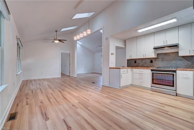 490 Poplar Lawn Rd, Surry, VA 23883 - kitchen with a ceiling fan, white cabinets, stainless steel electric stove, under cabinet range hood, and tasteful backsplash