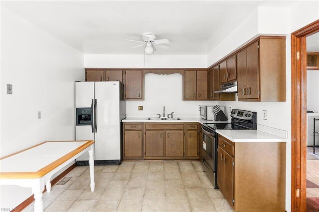kitchen featuring appliances with stainless steel finishes, a sink, under cabinet range hood, ceiling fan, and light countertops