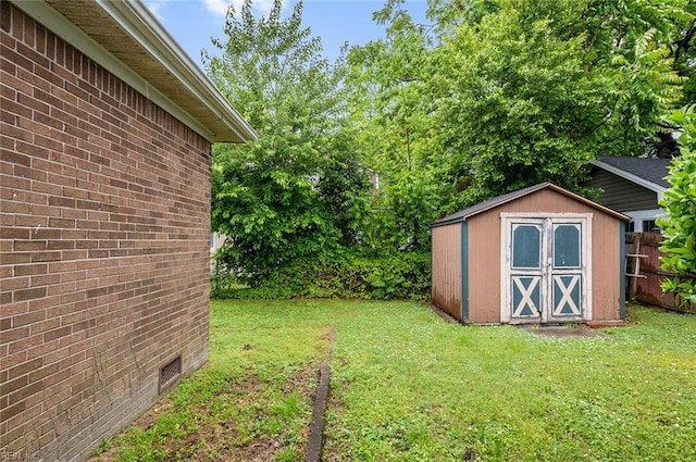 view of yard with a shed and an outbuilding