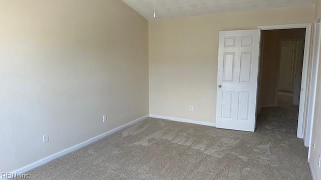 unfurnished bedroom with carpet and baseboards
