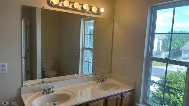 full bath featuring a sink and plenty of natural light