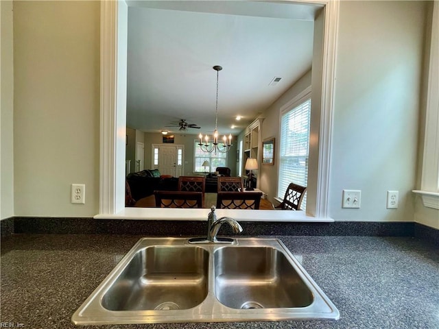 452 Blue Beech Way, Chesapeake, VA 23320 - kitchen featuring a sink, a chandelier, dark countertops, open floor plan, and pendant lighting