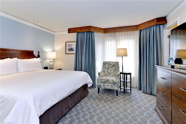bedroom with light colored carpet and crown molding