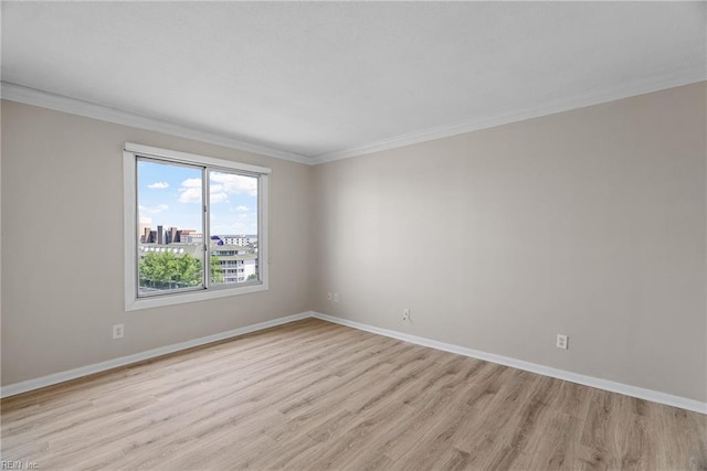 500 Pacific Ave Unit 812, Virginia Beach, VA 23451 - unfurnished room featuring baseboards, crown molding, and light wood-type flooring