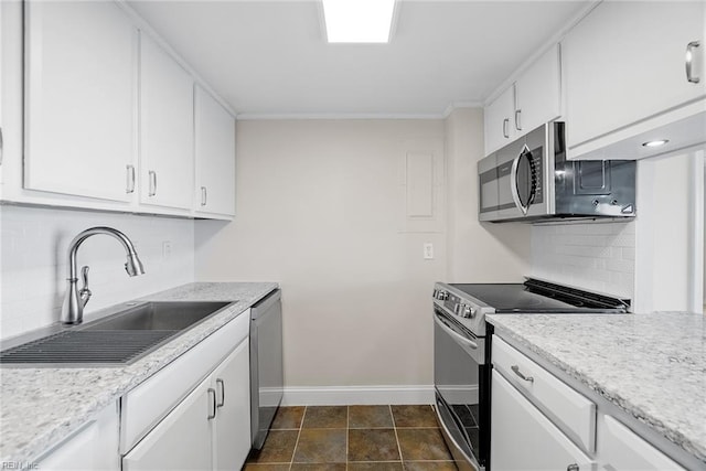 500 Pacific Ave Unit 812, Virginia Beach, VA 23451 - kitchen with a sink, white cabinetry, decorative backsplash, baseboards, and appliances with stainless steel finishes