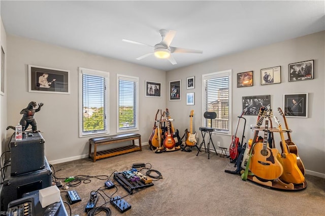 playroom with baseboards, a wealth of natural light, ceiling fan, and carpet floors