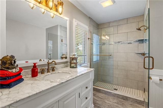full bathroom with vanity and a stall shower