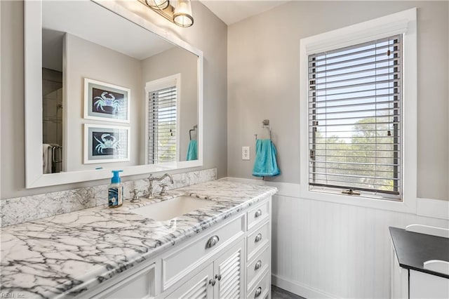 bathroom featuring wainscoting and vanity