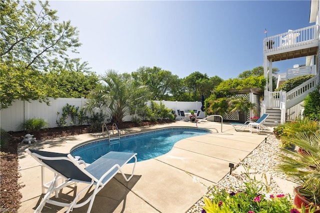 view of pool with a fenced backyard, a patio area, stairs, and a fenced in pool