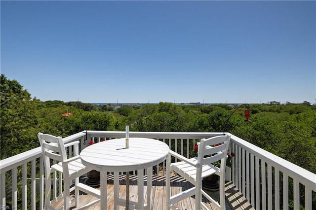 wooden deck with outdoor dining space