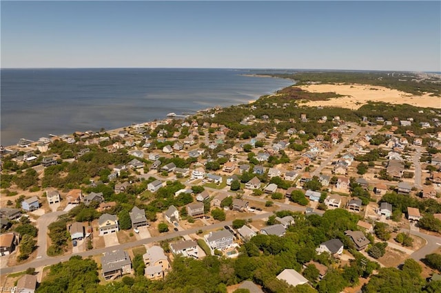 drone / aerial view featuring a water view and a residential view