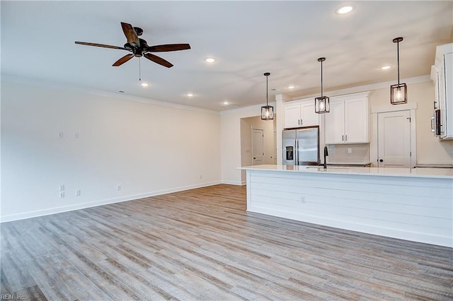 kitchen featuring stainless steel appliances, light countertops, and recessed lighting