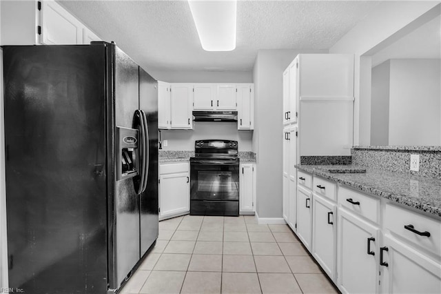 kitchen featuring under cabinet range hood, a textured ceiling, black appliances, and white cabinets