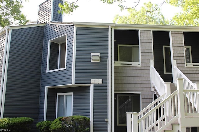 back of house with stairs