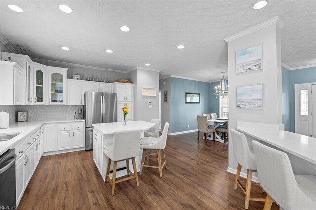 108 Hodges Cove Rd, Yorktown, VA 23692 - kitchen featuring a kitchen breakfast bar, appliances with stainless steel finishes, glass insert cabinets, white cabinets, and recessed lighting