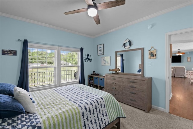 108 Hodges Cove Rd, Yorktown, VA 23692 - bedroom with crown molding, baseboards, ceiling fan, and light carpet