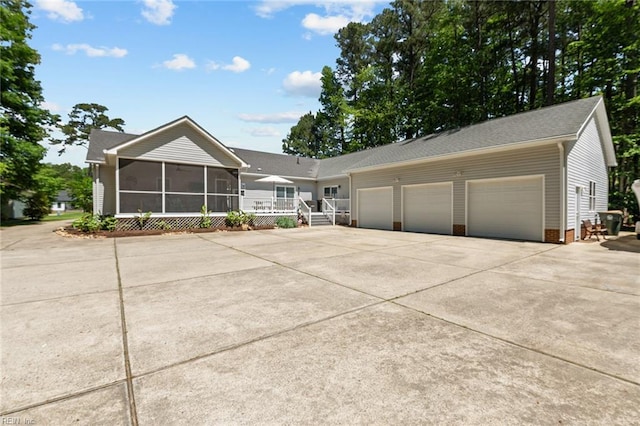108 Hodges Cove Rd, Yorktown, VA 23692 - ranch-style house featuring a sunroom, concrete driveway, and an attached garage