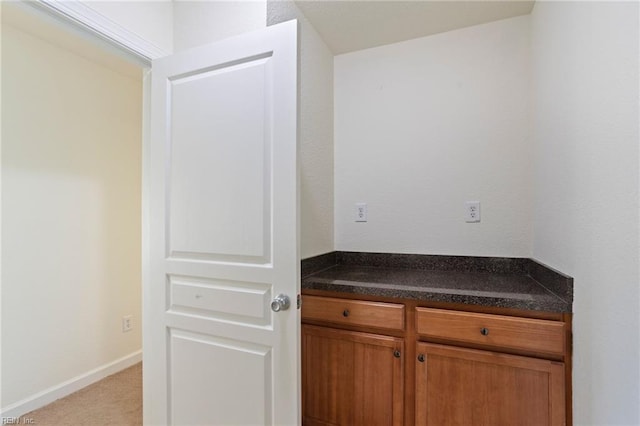 interior space featuring baseboards