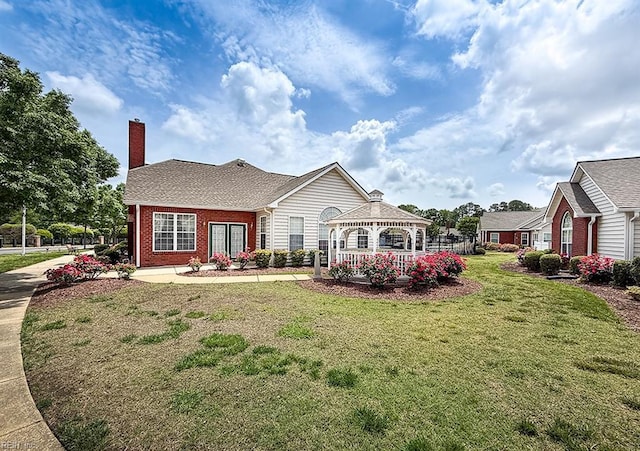 109 Villa Dr, Poquoson, VA 23662 - view of front of home with a gazebo, brick siding, a chimney, and a front yard