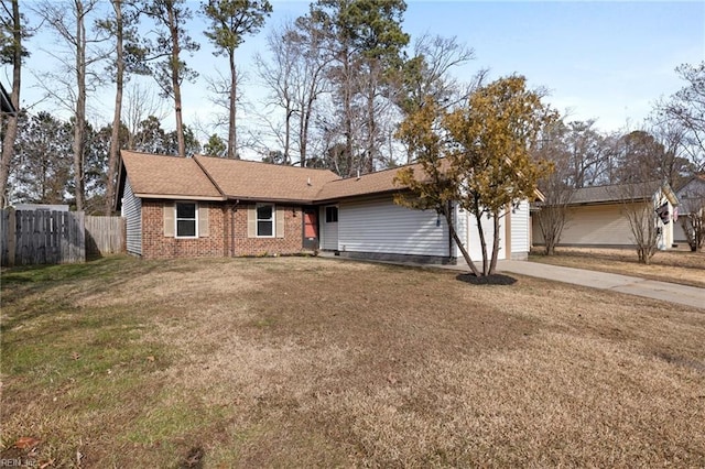 ranch-style house featuring driveway, an attached garage, brick siding, and roof with shingles