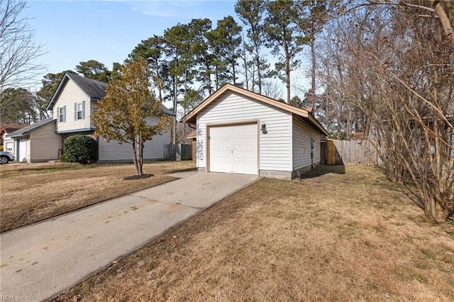 view of property exterior featuring concrete driveway and a garage