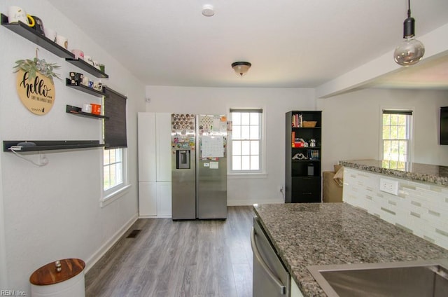 8123 Kenwood Dr, Norfolk, VA 23518 - kitchen featuring appliances with stainless steel finishes, plenty of natural light, light wood-type flooring, and baseboards