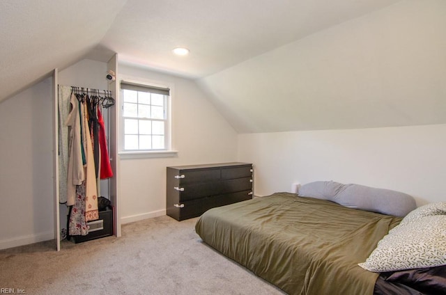 8123 Kenwood Dr, Norfolk, VA 23518 - carpeted bedroom with vaulted ceiling and baseboards