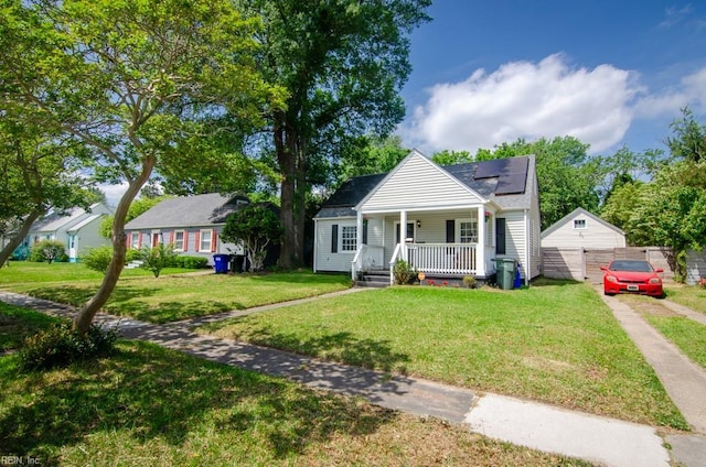 8123 Kenwood Dr, Norfolk, VA 23518 - bungalow featuring covered porch, solar panels, a front yard, and driveway