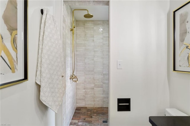 full bathroom with tiled shower