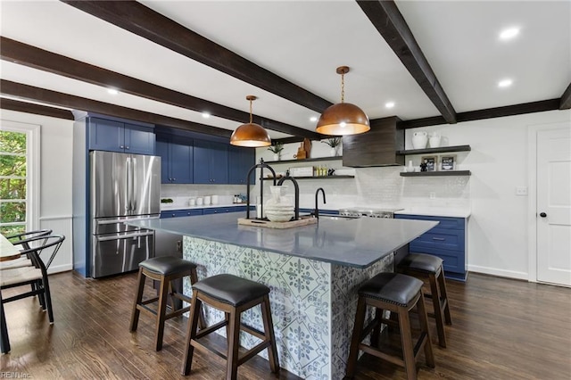 kitchen with freestanding refrigerator, premium range hood, blue cabinets, and open shelves