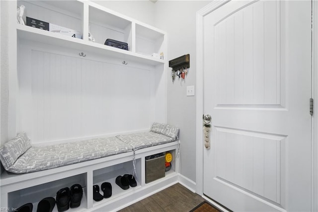 mudroom with dark wood-style floors