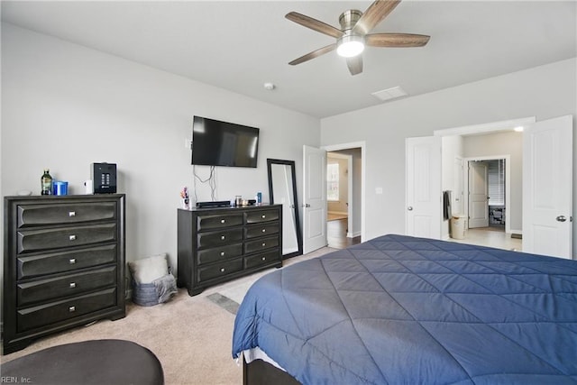 carpeted bedroom featuring baseboards, visible vents, and a ceiling fan