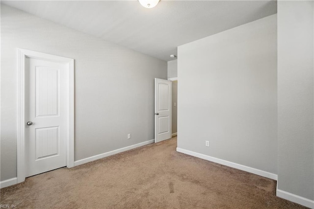 unfurnished bedroom with baseboards and carpet flooring