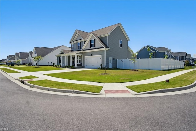 modern farmhouse style home with fence, an attached garage, a residential view, concrete driveway, and a front yard
