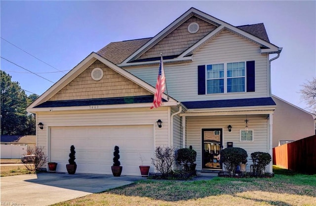 7463 Diven St, Norfolk, VA 23505 - view of front of property featuring fence, covered porch, an attached garage, concrete driveway, and a front yard