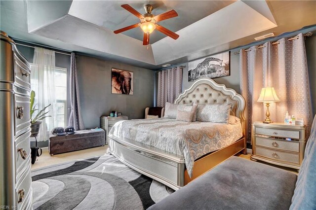 7463 Diven St, Norfolk, VA 23505 - bedroom with a ceiling fan, a tray ceiling, and carpet