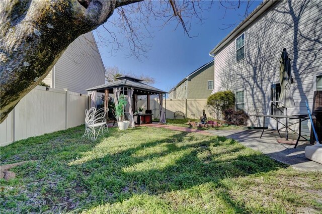 7463 Diven St, Norfolk, VA 23505 - view of yard with a fenced backyard, a gazebo, and a patio area