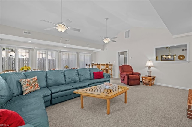 carpeted living area with baseboards, ceiling fan, visible vents, and vaulted ceiling