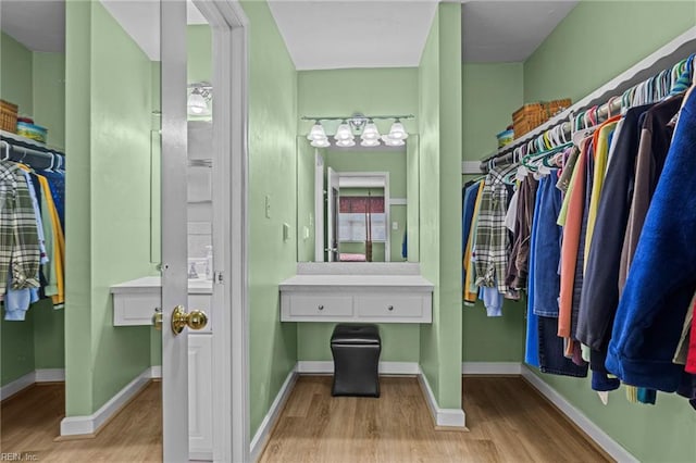 spacious closet with light wood-style flooring