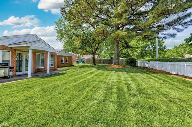 view of yard featuring a patio and a fenced backyard