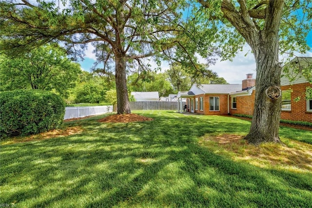 view of yard with fence