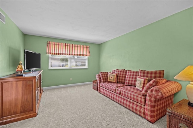 living room with carpet, visible vents, and baseboards