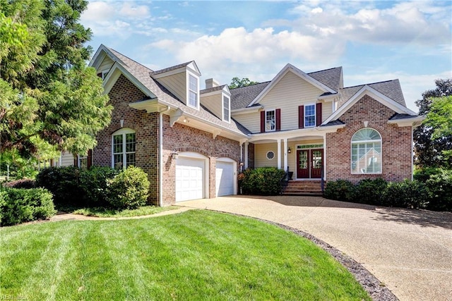 view of front of property with concrete driveway, brick siding, a front lawn, roof with shingles, and covered porch