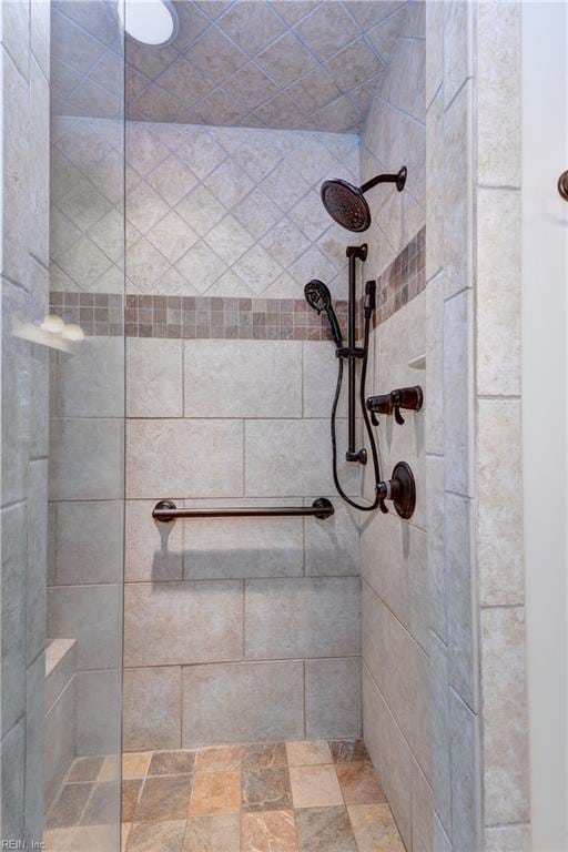 full bathroom with a tile shower