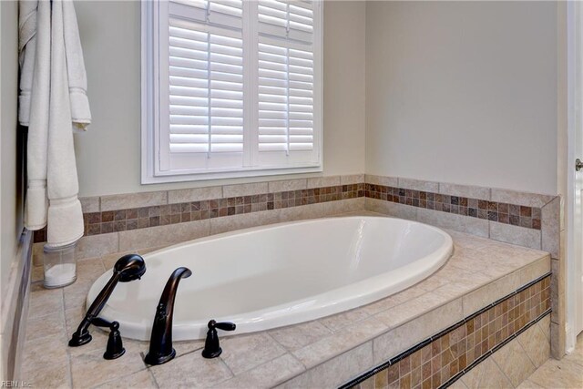 full bath with a garden tub