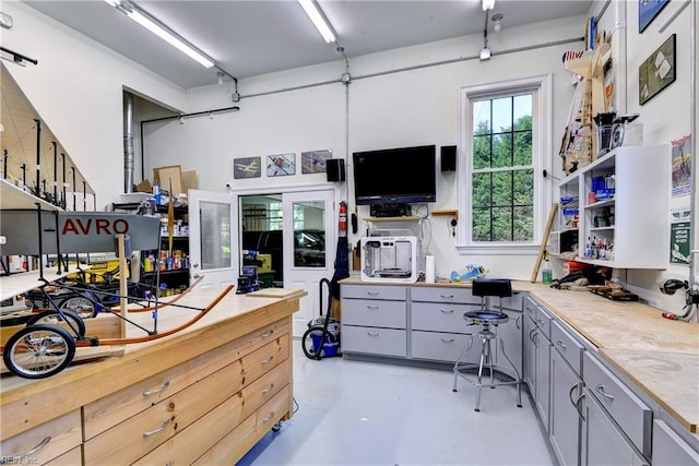 miscellaneous room with finished concrete floors