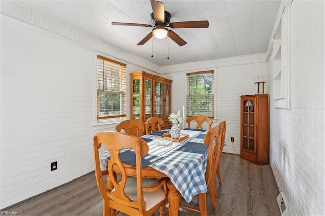 dining room with ceiling fan and wood finished floors