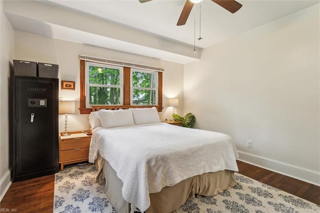 bedroom with dark wood-type flooring, baseboards, and a ceiling fan