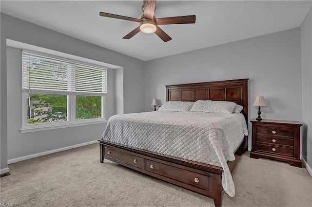 bedroom with carpet floors, baseboards, and a ceiling fan